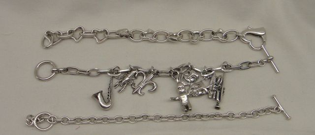 Three Sterling Lady's Charm and Link Bracelets
