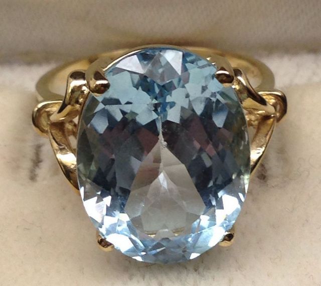 10KT Stamped Yellow Gold Ladies Blue Topaz Ring with a Bright Polish Finish.