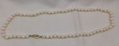 One even single strand pearl necklace 16.0
