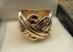 One 14KT Yellow Gold Lady's Cast Fancy Band with Bright Polish Finish.