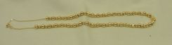 One Stamped 14KT Yellow Gold Lady's Beaded Necklace with a Bright Polish Finish.