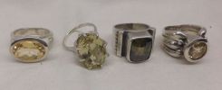 Four sterling Silver lady's citrine ring. Total Weight of Rings 26.90 dwt