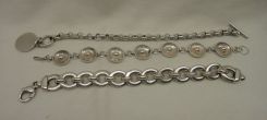 Three Sterling Lady's Charm and Link Bracelets; 2.61 ozt