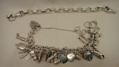 Two Sterling Lady's Charm and Link Bracelets; 2.285 ozt