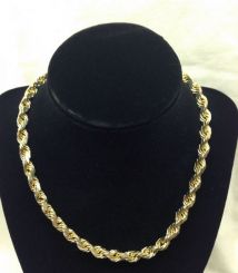 One stamped 10KT yellow gold uni-sex cast and hand assembled 5.5mm wide, 16