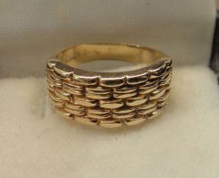 One 14KT Yellow Gold Lady's Cast Fancy Bands with Bright Polish Finish.