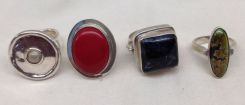 Four stamped sterling Silver lady's gemstone (natural and simulated) rings. Total Weight of Rings 61.10 dwt