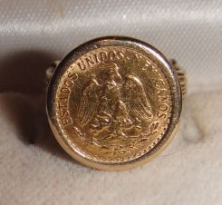 One 21KT and 14KT yellow gold lady's combination cast & die struck gold ring with a split shank with a bright polish with relief finish. The coin was minted in 1945. The coin is a 