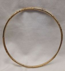 One stamped 18KT yellow gold lady's cast and hand assembled 4mm thick and 16