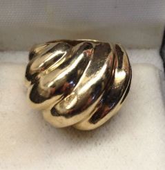 One 14KT Yellow Gold Lady's Cast Fancy Band with Bright Polish Finish.