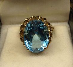 10KT Stamped Yellow Gold Ladies Blue Topaz Ring with a Bright Polish Finish.