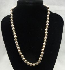 One Stamped 14KT Yellow Gold Lady's Beaded Necklace with a Bright Polish Finish.