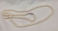 Lady's off-round freshwater pearl strand with sterling clasp; 24