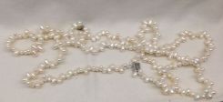 Lady's Irregular Freshwater Pearl Strand with silver clasp; 15