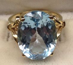 10KT Stamped Yellow Gold Ladies Blue Topaz Ring with a Bright Polish Finish.